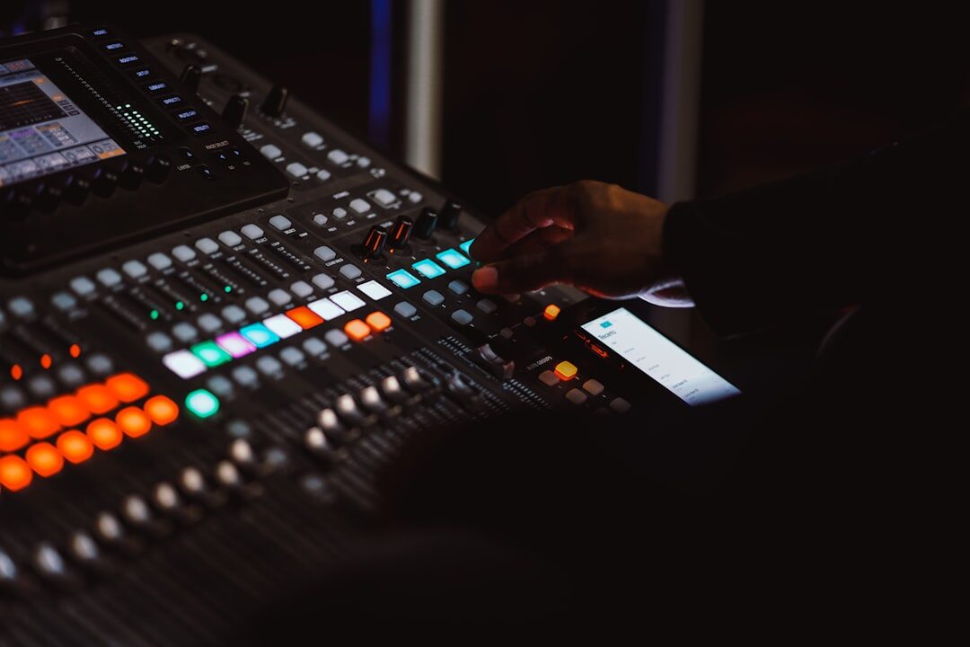 Professional recording studio with mixing console and equipment